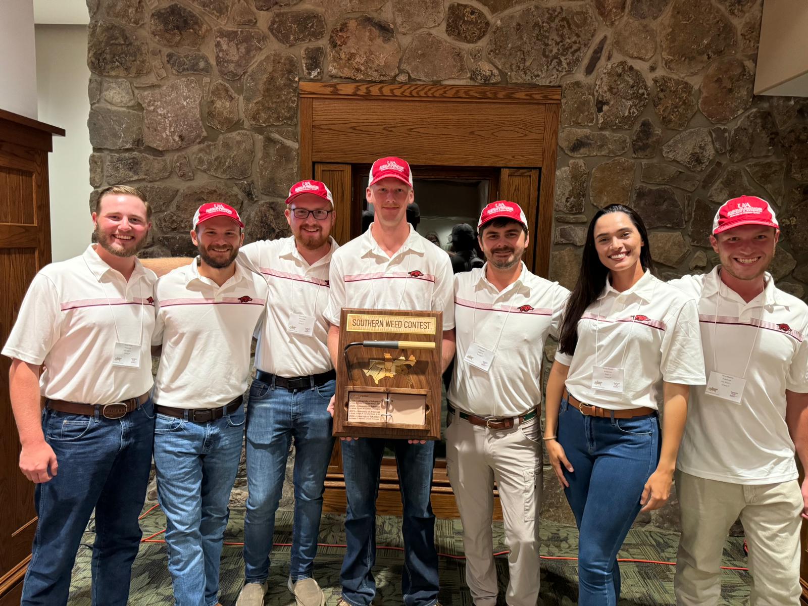 Weed Team Fall 24 group photo with award